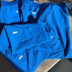 Figs Size XLP for the bottoms L tops in the royal blue. Bundle 2 tops 2 bottoms